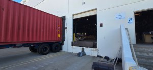 Shipping container parked at the Enterprise Order Solutions California warehouse for outbound freight loading and transload or crossdock movement.