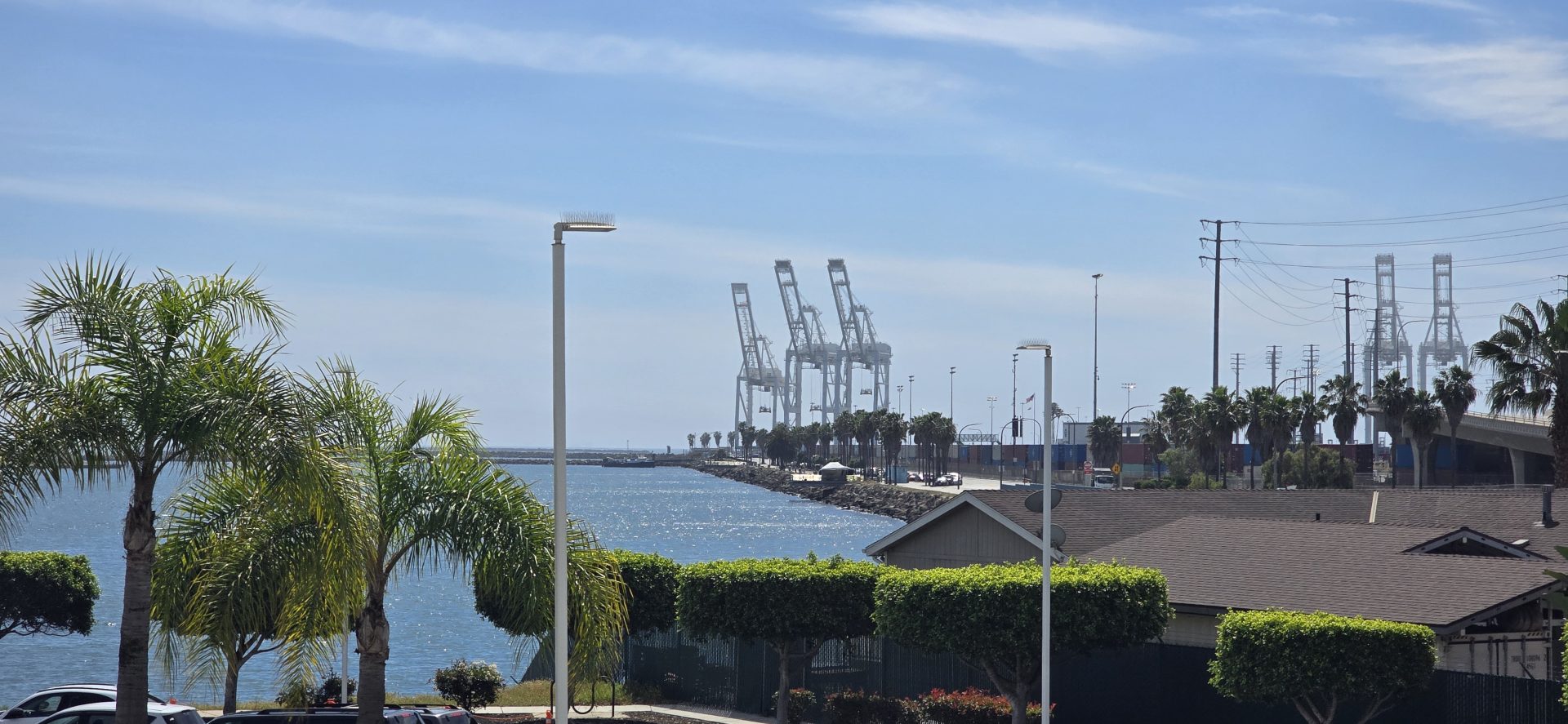 Port of Long Beach visible in the distance from the shoreline near San Pedro, California.