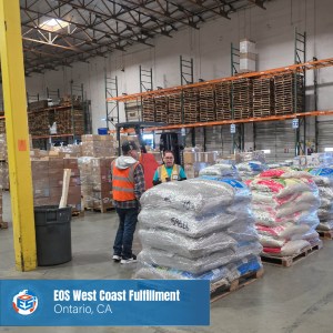 EOS staff receive palletized bagged goods in shrink wrap at the West Coast Fulfillment Center in Ontario, California.