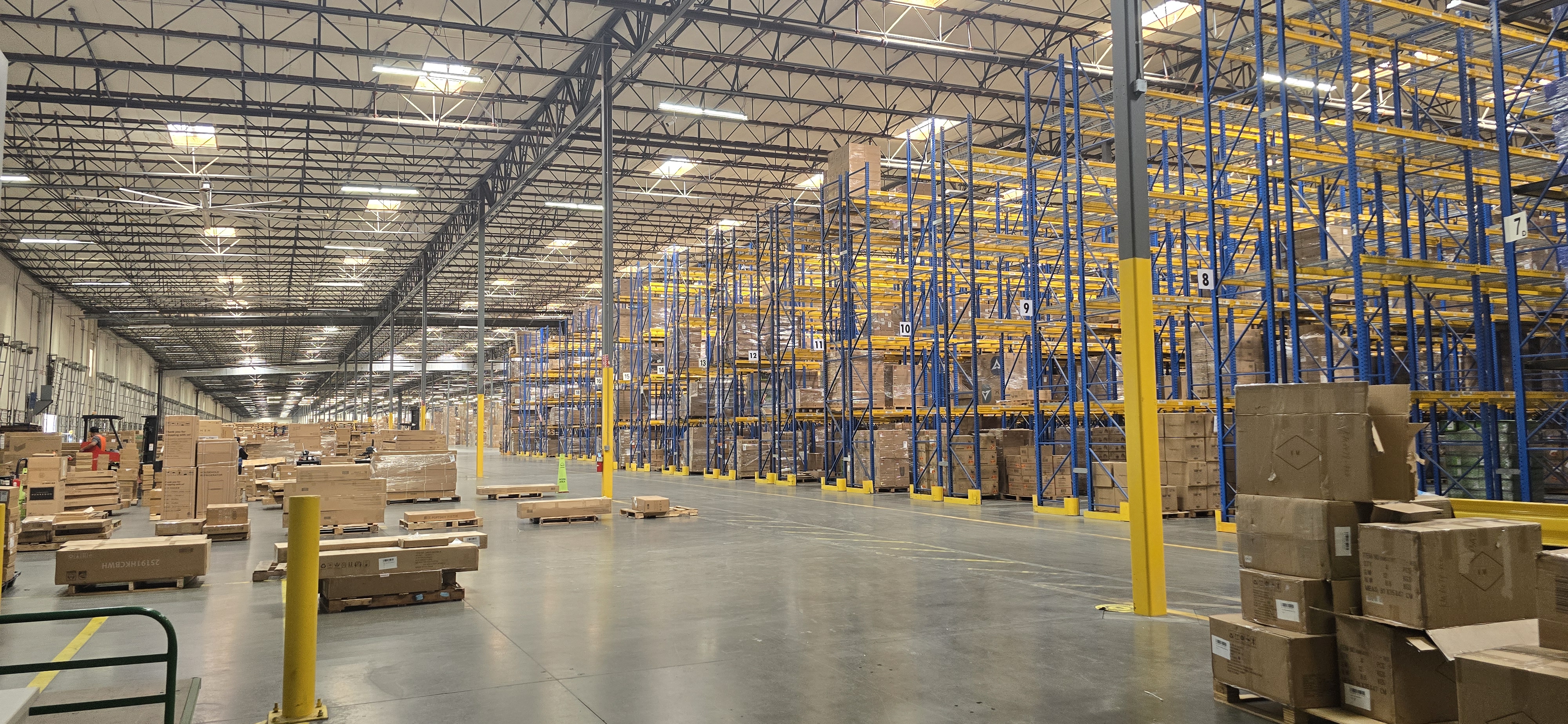 Wide warehouse floor and rack storage inside EOS Southern California Warehouse.