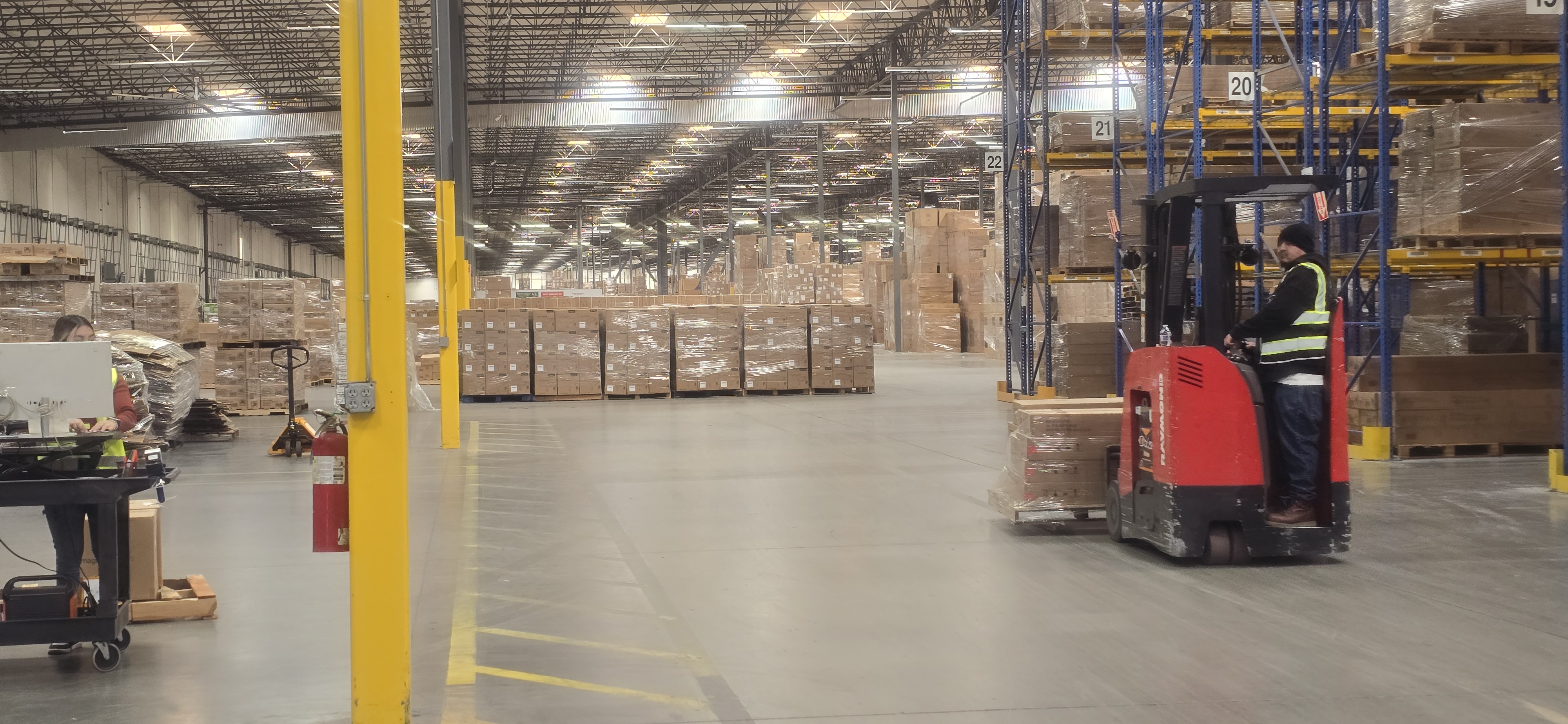 Forklift moving freight through EOS Southern California Warehouse in Jurupa Valley California.