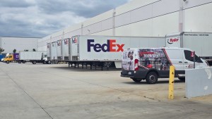 FedEx trailers being loaded at Enterprise Order Solutions warehouse docks in Ontario, California for order fulfillment.