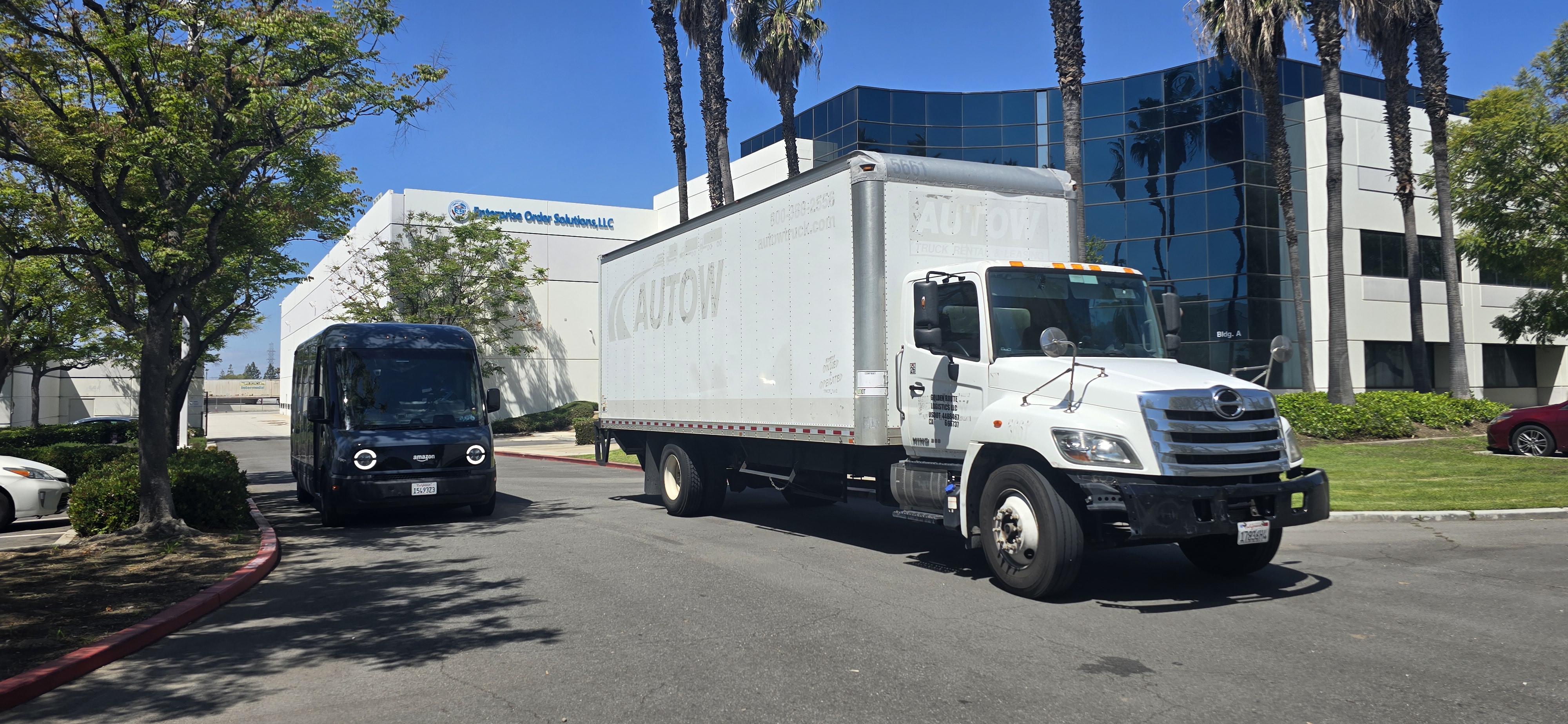White box truck parked in front of EOS corporate headquarters.